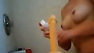 Amateur girlfriend rides dildo toy in the bathroom