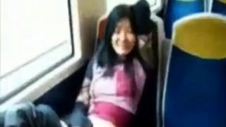 Asian milf rubs her clit on a train.