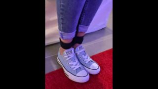 Girl with blue converse and tight jeans tied up by rope