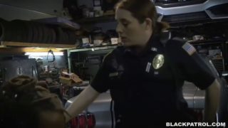 Two white police whores ride a big black cock in a chop shop