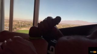 Stroking big dick with a view