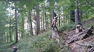 Standing pissing in a woods in a bunny mask and fishnet