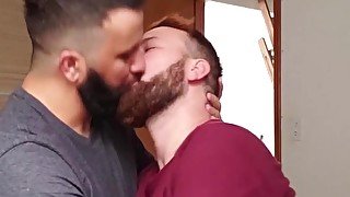 Two men kissing