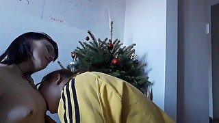 kissing my love in front of a little xmas tree