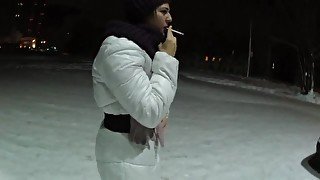 smoking girl in a white jacket