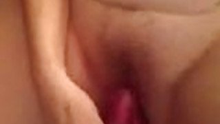 Wife masturbates and plays with her pussy in the bathroom.