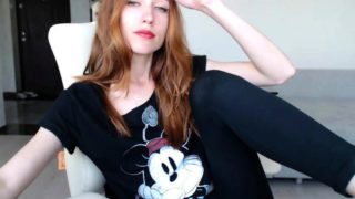 Sexy redhead camgirl exposes her slim body and tight peach