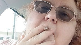 BBW smoking in pink sweater in her car talking to her fans