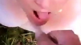 Collared girl takes daytime outdoor facial!