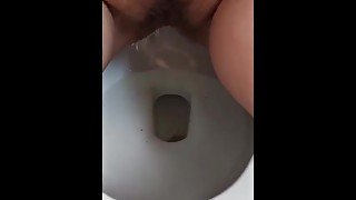 Hairy pussy peeing in toilet