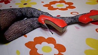 Leopard tights and red high-heeled shoes