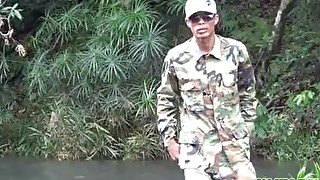 Soldier wades a river for a blowjob