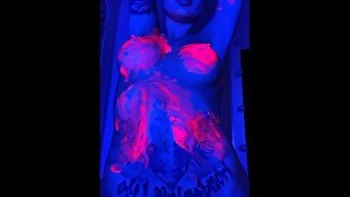 babe in neon in paint plays with pussy