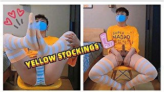 Boy in yellow t-shirt and stockings masturbates and cums at home