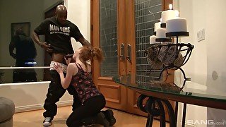 Eye catching redhead Kierra Wilde gives a really good blowjob to black stud