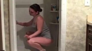 Hot milf cleaning the shower showing her ass