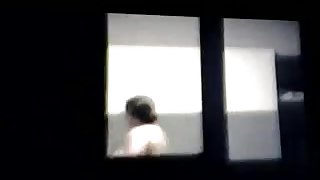 woman spied topless through window