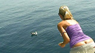 Obedient housewife Sandy takes a sun bath on the boat topless