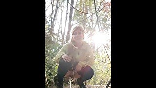 Peeing girl in the forest