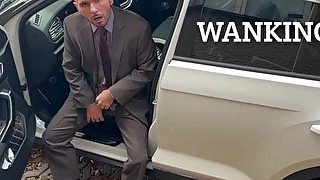 Businessman is playing with dildo in a Car