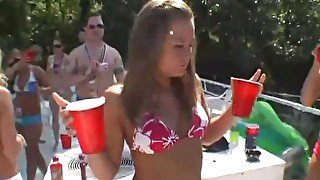 Bikini girls fool around on a boat