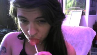 licking and sucking a lolipop like a little slut