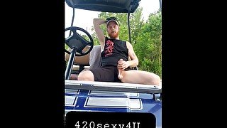 Hairy ginger showing off dick outdoors on golf cart