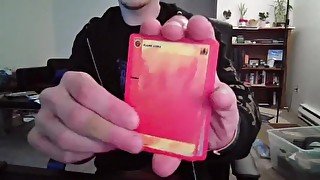 Cute Nerd Opening a Pack of Cards