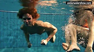 Two sexy amateurs showing their bodies off under water