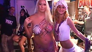 Costume girls at party dance and fool around