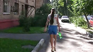 Olga soaks her shorts in the street in public pissing solo clip