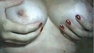 Buxom Brazilian mommy exposes her juggs and tight shaved pussy