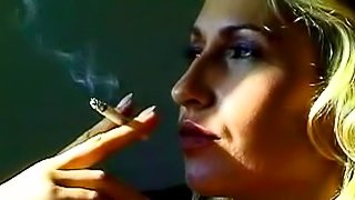 Sweet blonde is smoking in a sexy way