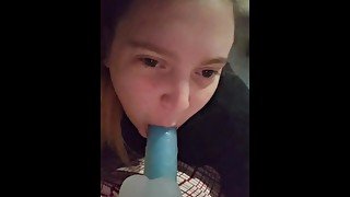 Blonde babe sucks on dildo