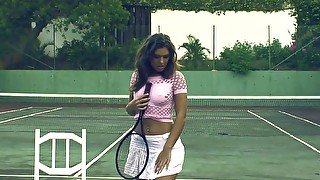 Beautiful solo brunette pleasuring her cunt on a tennis court