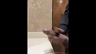 Huge cumshot in public bathroom