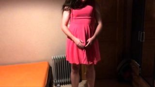 Sissy in pink dress strokes her cock with cumshot on face