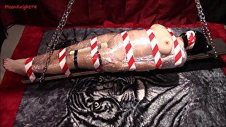 Mummified and suspended to multiple orgasms