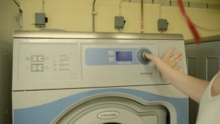 Patient girl takes her time to masturbate by a washing machine