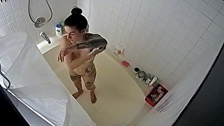 Nice tattooed girl taking a bath