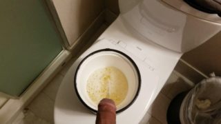 Pissing Full Bladder into a bucket.