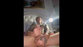 Tattooed guy masturbating with cumshot