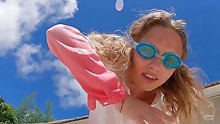 Skinny blonde ukrainian teen Clarise reveals her small tits in the pool