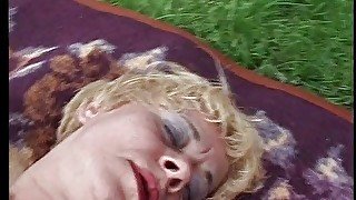 Sexy older blonde babe masturbates outside