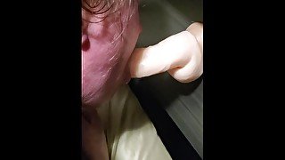 Wife sucking dildo while getting fucked