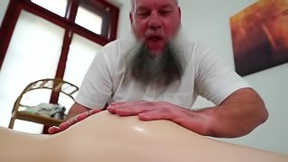 Old masseur with shaggy beard licks and fucks client's pussy