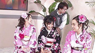 Three Japanese babes blow a group of men with hairy cocks and swallow cum