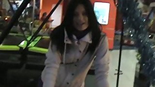 Whorish brunette wins a dick for a solid blowjob in the amusement hall