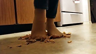 Cheeseburger and fries crushed under nylon feet, walkover style