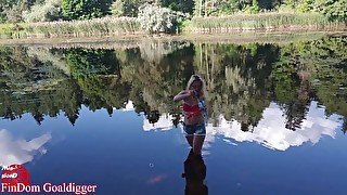 Girl in glasses blowing bubbles on the river. Full clip in Fan Club